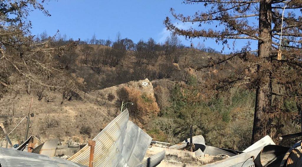 Intact Star of David amidst Wildfire Wreckage